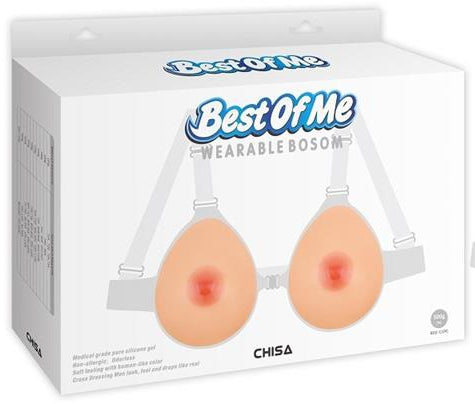 Faux seins réalistes en silicone forme goutte d'eau à bretelles transparentes et réglables de 1000 g de la marque Chisa Novelties dans leur packaging