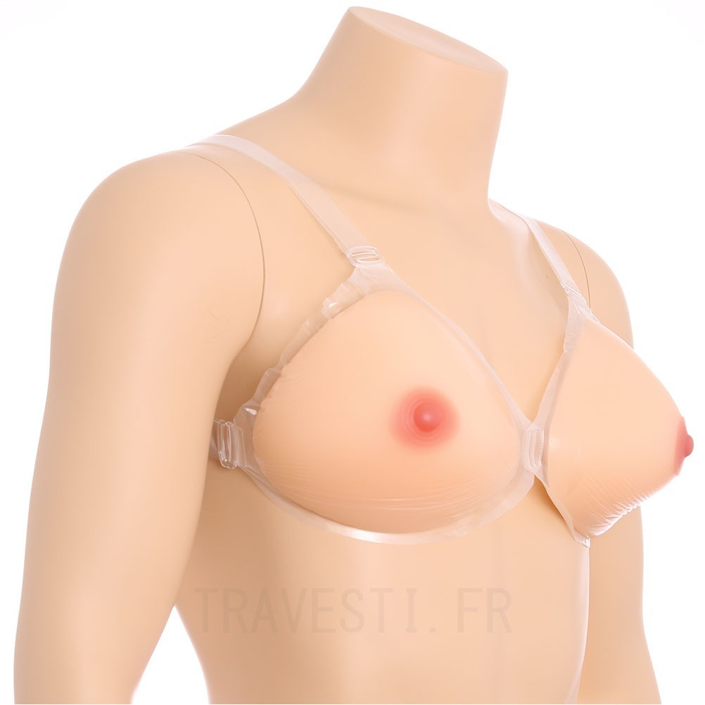 Une paire de faux seins en silicone à placer dans le soutien-gorge de forme triangulaire pour parfaitement épouser la forme des pectoraux.