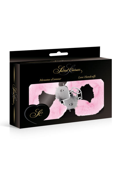 Menottes en fourrure et métal, rose de la marque Sweet Caress dans son emballage